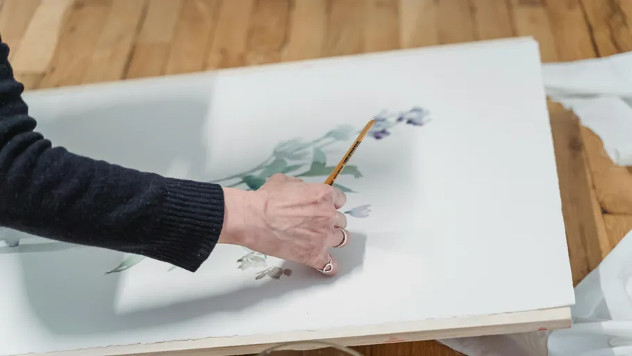 Hand painting flowers on paper.