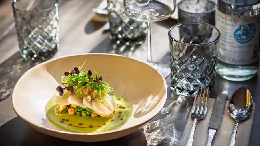 Gourmet dish in elegant restaurant setting.