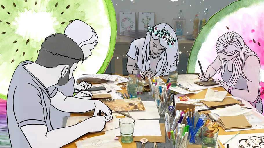 People drawing at a table with fruity background.