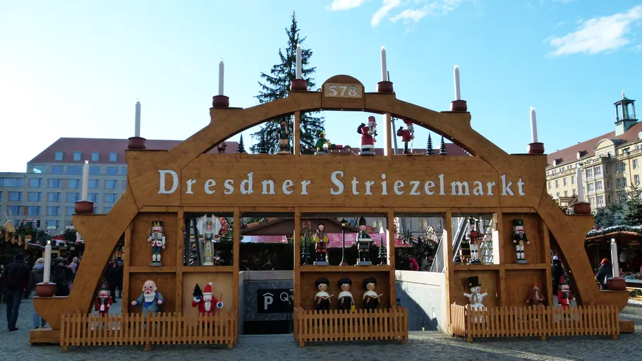Christmas market entrance with festive decorations.