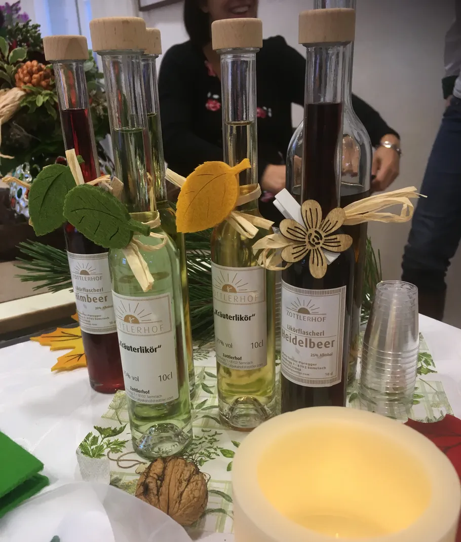 Bottles of herbal liqueur on display table.
