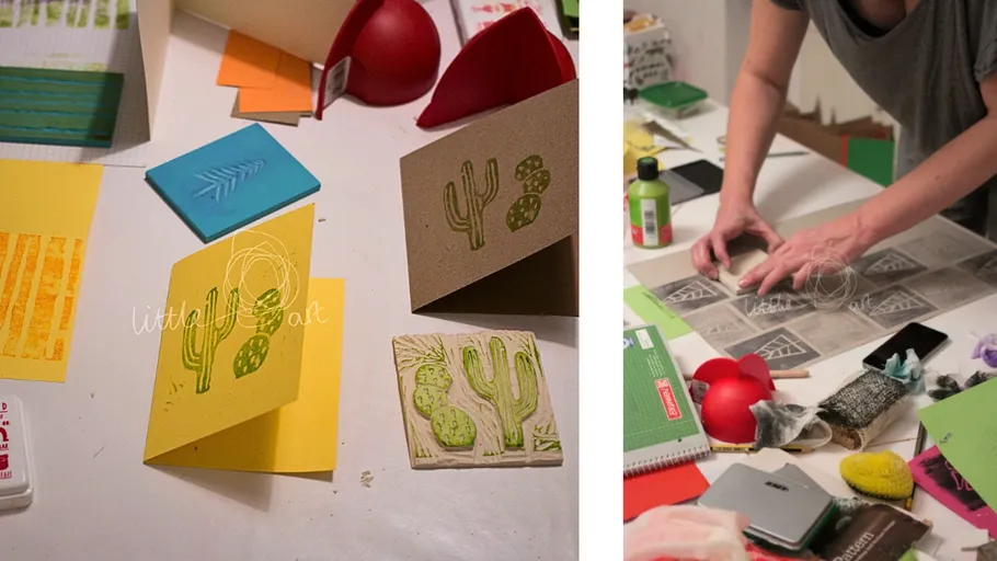 Handcrafted cards and stamps on a workshop table.