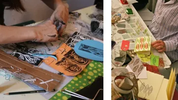 Two people crafting with paper and materials.