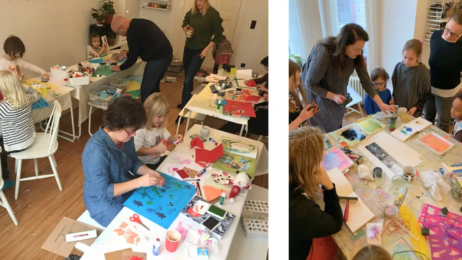 Children crafting with adults in a classroom.