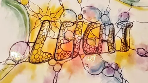 Colorful artistic text design with abstract bubbles.