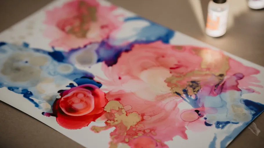 Abstract painting with colorful ink splashes.