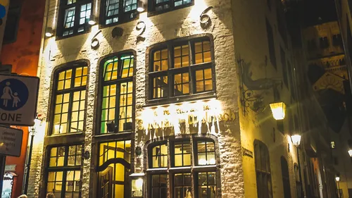 Historic building exterior illuminated at night.