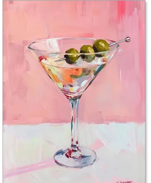 Martini glass with olives, pink background.
