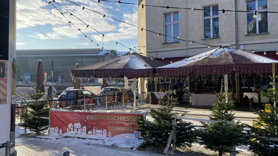 Cafe terrace with Christmas trees in winter.