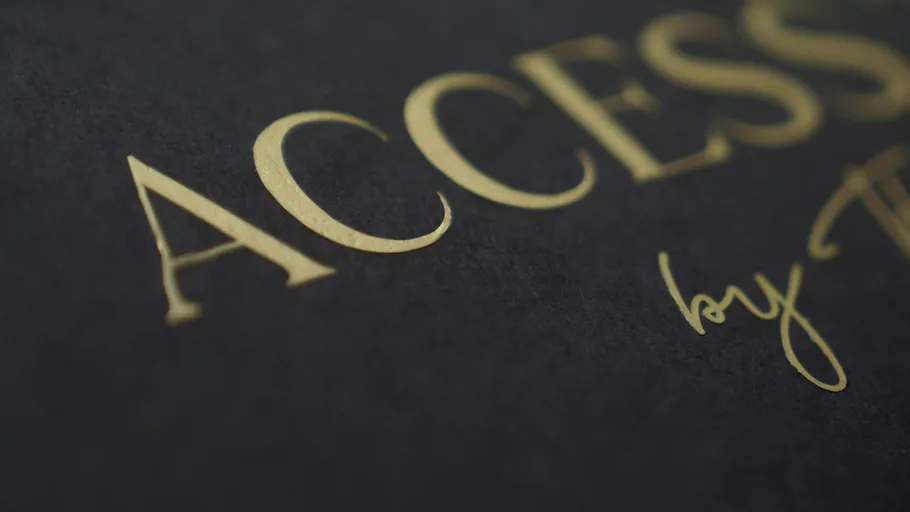 Close-up of gold text on dark background.