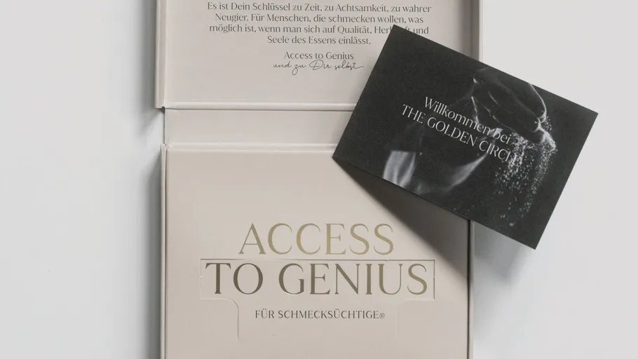 Invitation card on top of a luxury box.