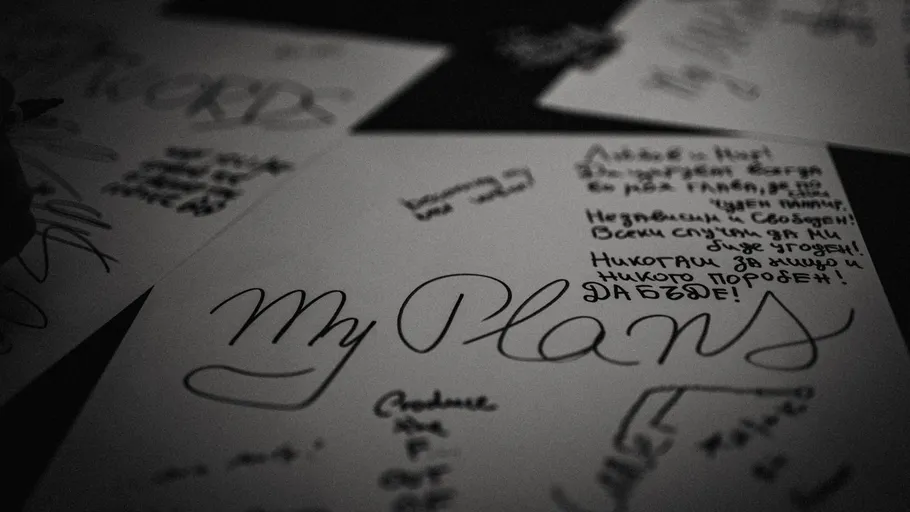 Handwritten notes and doodles on paper.