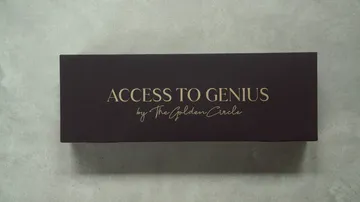 Black box with gold text on a table.