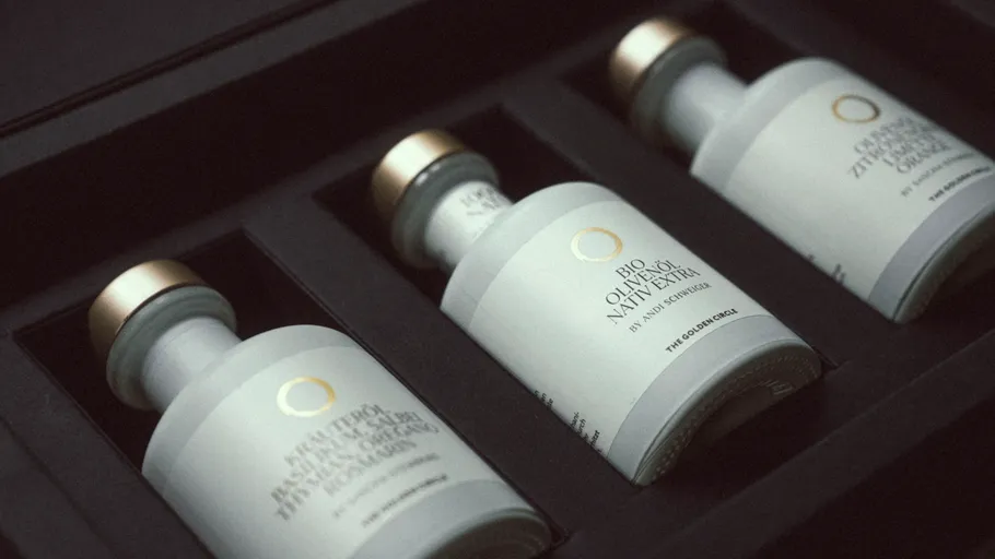 Three olive oil bottles in a black box.