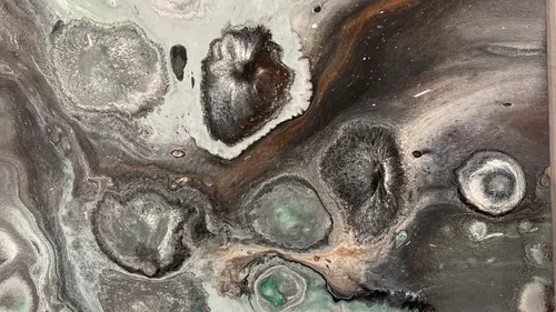 Abstract painting with swirling colors and textures.