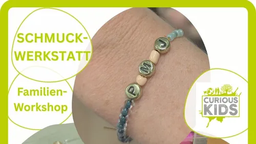 Beaded bracelet with initials on wrist.