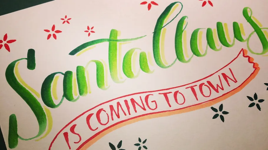 Colorful festive lettering on white background.