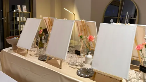 Blank canvases on easels in art class.