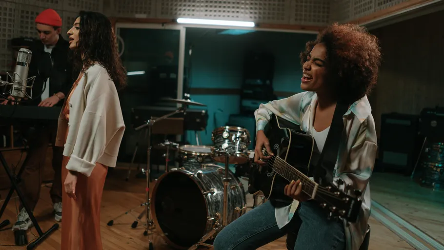 Musicians performing in a recording studio.