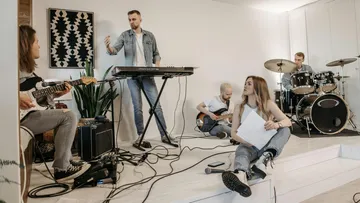 Band rehearsing in a bright room.