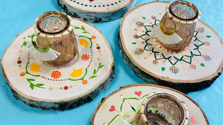 Decorative glasses on painted wood slices.