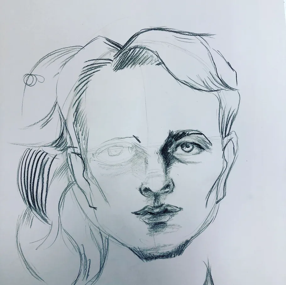 Pencil sketch of a half-finished face.