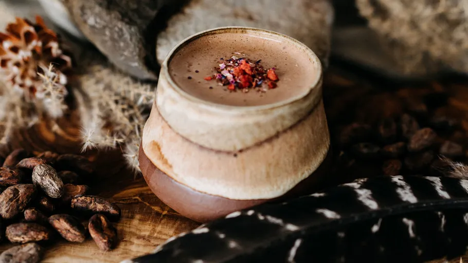 Ceramic cup with hot chocolate and spices.
