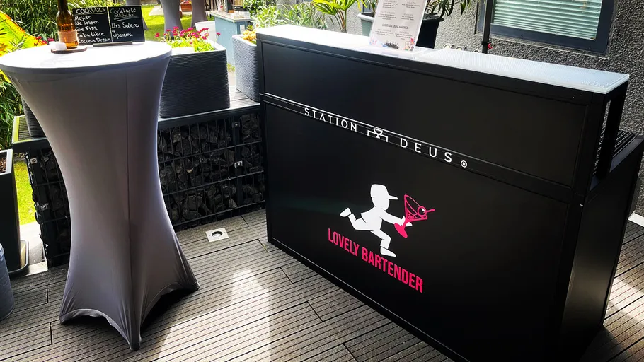 Cocktail station and table on a terrace.