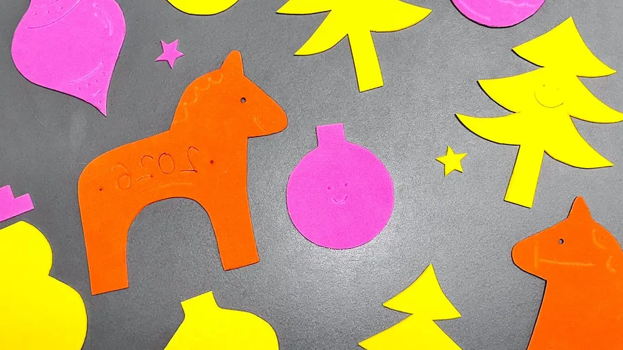 Colorful paper cutouts on a gray background.