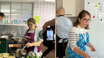 Woman cooking and preparing food in a kitchen.