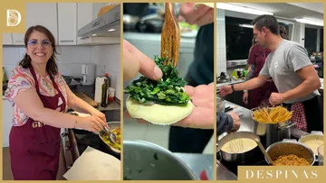 People cooking various dishes in a kitchen.