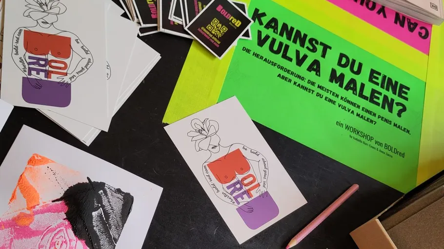 Colorful art materials on a tabletop.