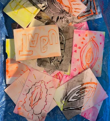 Colorful, abstract drawings on small cards.