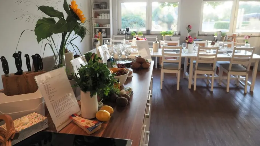 Dining tables set in a home kitchen.