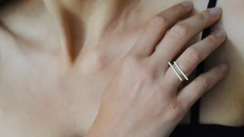 Woman wearing a silver ring on hand.