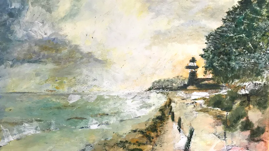 Lighthouse near a rocky coastal landscape.