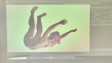 3D-Charakter mit lila Maske auf Bildschirm.