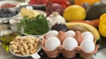 Variety of fresh foods on a kitchen counter.