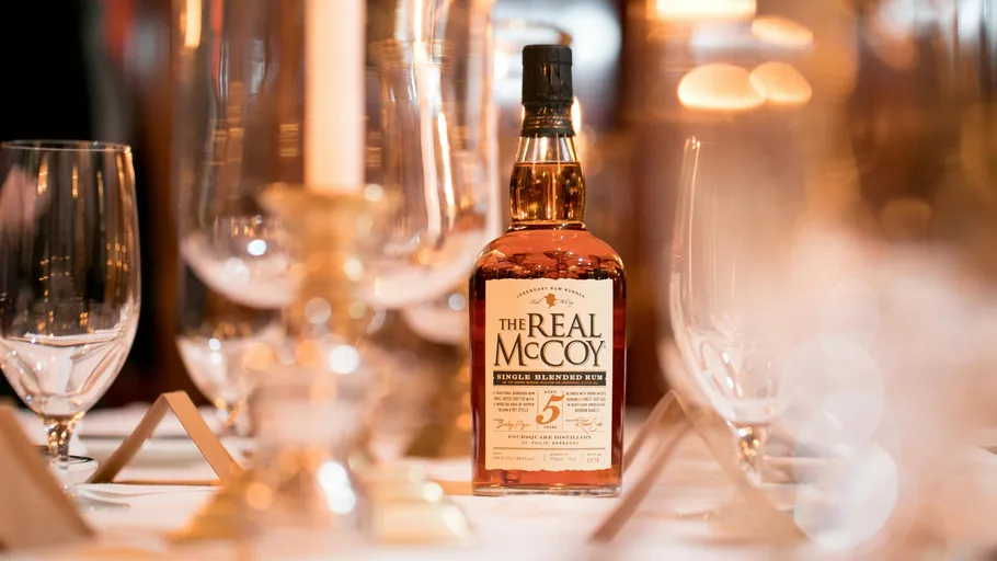 Rum bottle on elegant dining table.