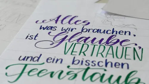 Handwritten inspirational quote in colorful letters.