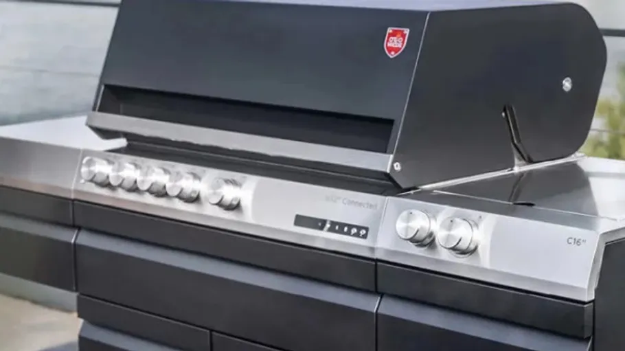 Modern black grill with control knobs.