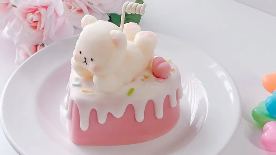 Cute bear dessert on pink plate.