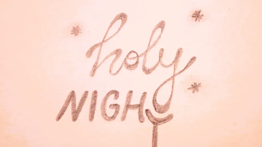 Handwritten 'holy night' with stars.