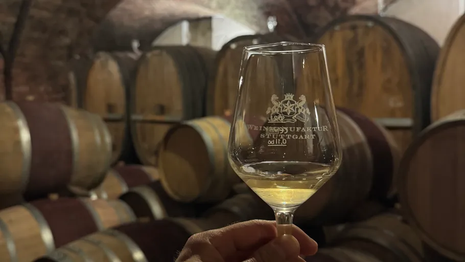 Wine glass held in barrel cellar.