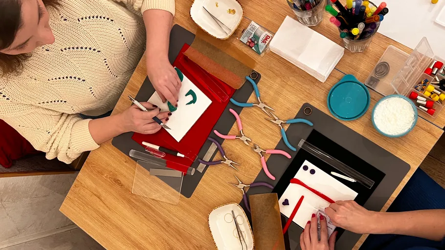 Two people making crafts at a table.
