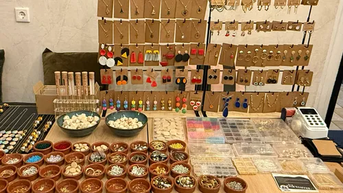 Colorful earrings displayed on tables.