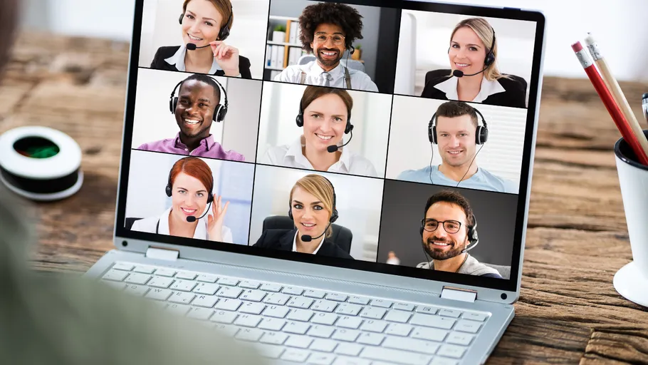 People having a video conference on a laptop.