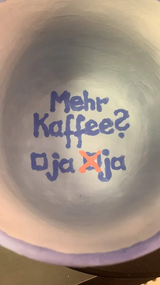 Inside of a mug with humorous text.