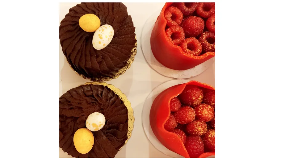 Chocolate and raspberry desserts on display.