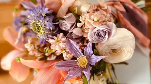 Colorful bouquet with pink and purple flowers.